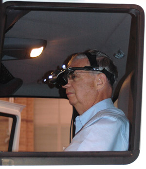 Driver in International Truck Driving Simulator Behind the Wheel - goggles (HMD) head shot